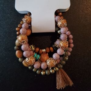 Set of 4 bracelets with tree ornament and tassel.